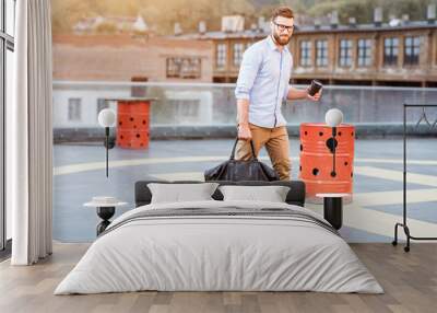 Businessman skateboarding on the rooftop Wall mural