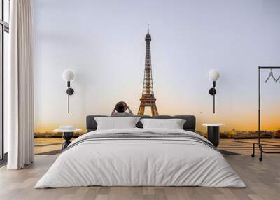 Famous square with great view on the Eiffel tower and woman standing back enjoying the view in Paris Wall mural