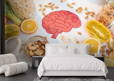 Human brain drawing with variety of healthy fresh fruits and vegetables on the table. Concept of balanced nutrition for brain health Wall mural