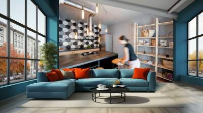 Modern loft dinning room with motion blurred woman doing housework Wall mural