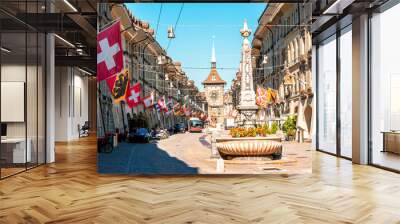 Street view on Kramgasse with fountain and clock tower in the old town of Bern city. It is a popular shopping street and medieval city centre of Bern, Switzerland Wall mural