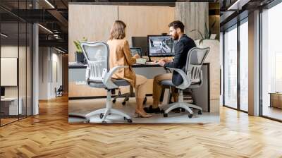 Two creative office employees making interior design on the computer and digital tablet at the modern office of architectural firm. Concept of 3d modeling and digital Interior designing Wall mural