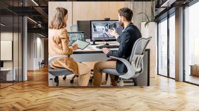 Two creative office employees making interior design on the computer and digital tablet at the modern office of architectural firm. Concept of 3d modeling and digital Interior designing Wall mural