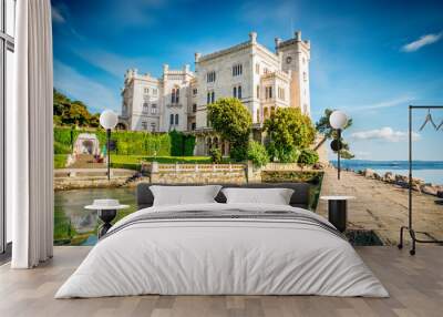 View on Miramare castle on the gulf of Trieste on northeastern Italy. Long exposure image technic with reflection on the water Wall mural