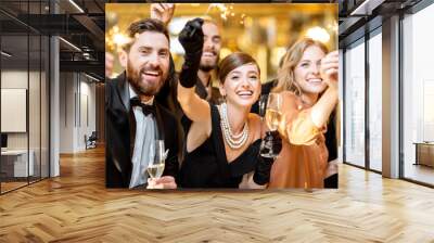 Well-dressed people celebrating New Year indoors Wall mural