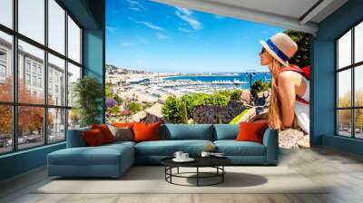 Young female traveler enjoying great view on french riviera in Cannes city Wall mural