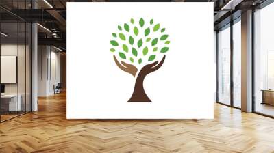 human hands and tree with green leaves. logo, symbol, icon, illustration, vector, template, design Wall mural