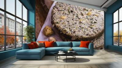 vegan hamburger based on various vegetables, raw, without frying, on wooden background.Vegan food and healthy living concept. Wall mural