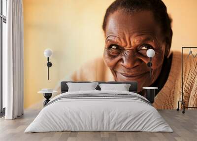 A black old woman smiling and looking at the camera Wall mural