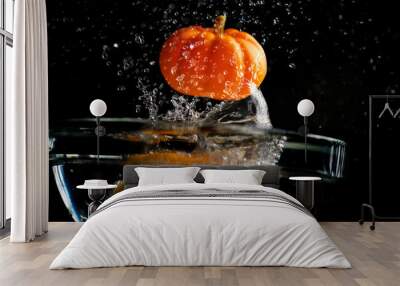 pumpkin falling in water Wall mural