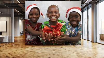 Three Cute African Children celebrate Christmas Wall mural