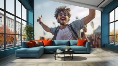 young guy man happy dancing and enjoy music festival concert Wall mural