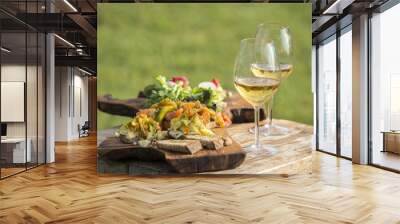 Italian appetizer with white wine on wood table Wall mural