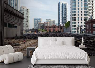 Commuter train tracks cutting between buildings in downtown Chicago Wall mural