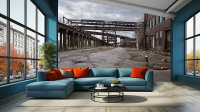 Crossing elevated train tracks and vintage red brick abandoned factory Wall mural