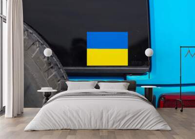 Ukrainian flag icon on vehile window showing solidarity with Ukraine Wall mural