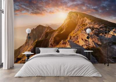 mountain majesty rugged beauty of a mountain peak at sunset focusing on the intricate details of rocks and vegetation bathed in the warm golden light of the fading day Wall mural