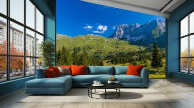 Caravan in summer mountain landscape, Alps, Italy Wall mural