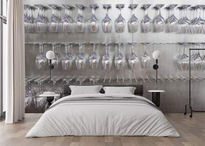 Wine glasses hanging on wall in wine shop Wall mural