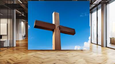 wooden cross against a blue sky a symbol of faith and hope Wall mural