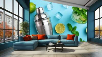 mojito cocktail overhead panorama summer cold drink with lime fresh mint and ice cool beverage on a blue background a flat lay shot with a shaker Wall mural