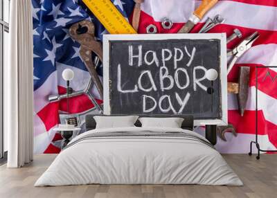 American National Patriotic Workers Happy Labor day Holiday background. Construction and manufacturing tools on wooden background with stars, red white blue striped US flag Wall mural