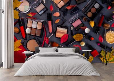 Autumn make up set on black table background, with autumn leaves and beauty accessories. Various makeup professional cosmetics on white table background with fall cozy sweater and woman handbag Wall mural