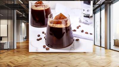 Cold Brew Coffee Espresso Carajillo Cocktail with frozen espresso ice cubes, strong black coffee, liqueur and Vodka, on white kitchen table background copy space Wall mural