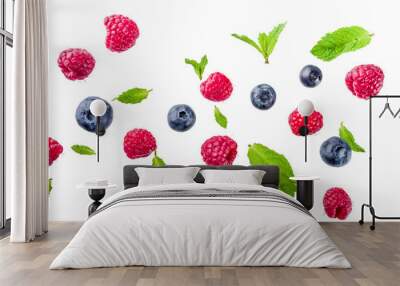 Creative layout, background, with fresh berries, simple pattern on white background. Raspberry, blueberry, mint leaves, slices of lemon. Wall mural