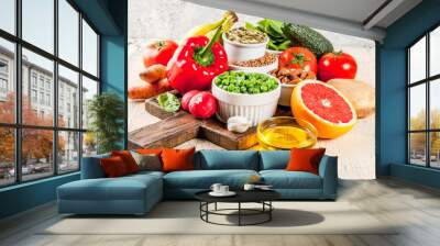 Healthy food background, trendy Alkaline diet products - fruits, vegetables, cereals, nuts. oils, light concrete background Wall mural