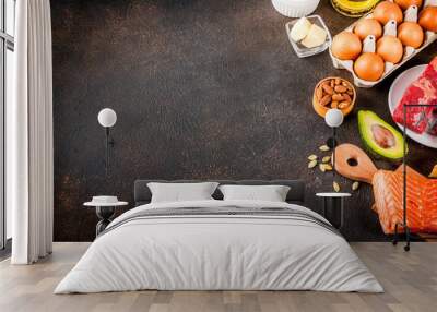 Ketogenic low carbs diet concept. Healthy balanced food with high content of healthy fats. Diet for the heart and blood vessels. Organic ingredients, dark rusty background, copy space top view Wall mural