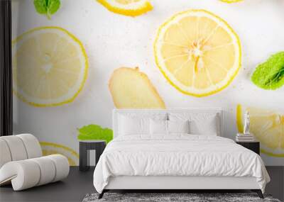 Mojito, lemonade cocktail or sour infused water ingredient. Flatlay with sliced lemon, ginger and mint leaves, layout on white background top view copy space banner Wall mural