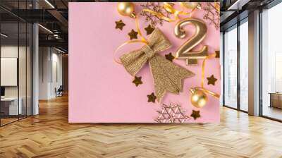 New year 2023 celebration greeting card background Gold numbers 2023 with golden party decoration, stars confetti on pink background. Flat lay, Merry Christmas, Noel happy New Year holidays banner Wall mural