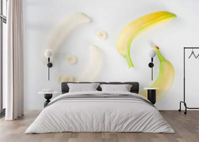 Pattern of fresh banana slices isolated on white background top view Wall mural