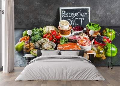 Pescetarian diet plan ingredients, healthy balanced grocery food, fresh fruit, berries, fish and shellfish clams,  black background copy space  Wall mural