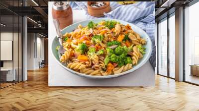 Pumpkin and broccoli vegan warm pasta salad, fall season salad, autumn comfort cozy food concept  Wall mural