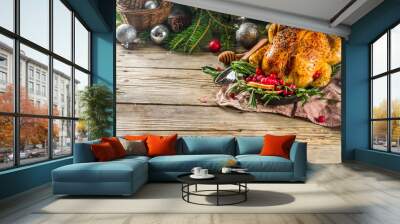 Traditional Christmas and Thanksgiving roasted whole chicken with fruit and rosemary. Rustic wooden background copy space with Christmas decoration Wall mural