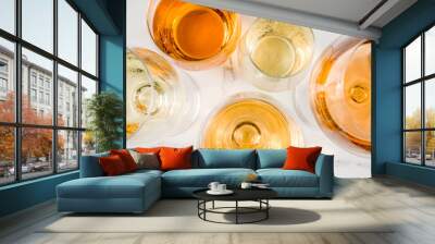 Trendy orange wine, with white wine in different glasses, white concrete background copy space Wall mural