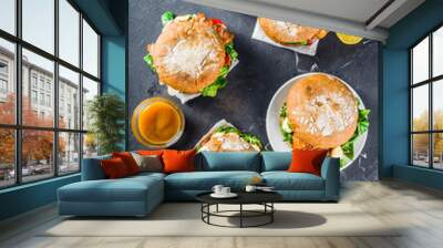 Various seafood and fish burgers assortment. Homemade healthy burger with grilled prawn, salmon, tuna, sea bass, fresh herbs, mozzarella cheese and baby spinach. Wall mural