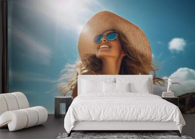 beautiful woman looking to sun at beach wearing straw hat and sunglasses and white floral dress	 Wall mural