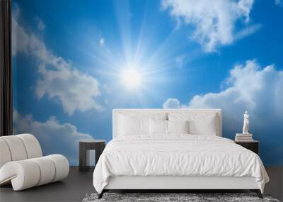 blue sky with fluffy white clouds and sun with lens flare Wall mural