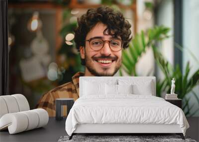 cool young guy within yellow plaid shirt with white tshirt and glasses portrait in modern office, diversity	
 Wall mural