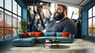 plus size man with beard smiling in gym candid portrait Wall mural