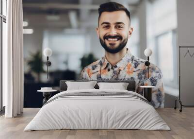 portrait of creative smiling man at work wearing a floral print shirt smiling to camera in office, made with generative ai Wall mural