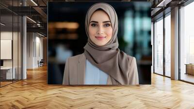 smiling young professional muslim woman in office portrait wearing brown jacket and hijab headscarf 	 Wall mural