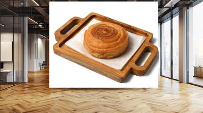 freshly baked cinnamon roll served on wooden cutting board isolated on white background Wall mural