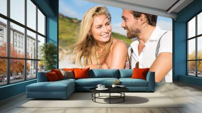 Attractive couple at beach Wall mural