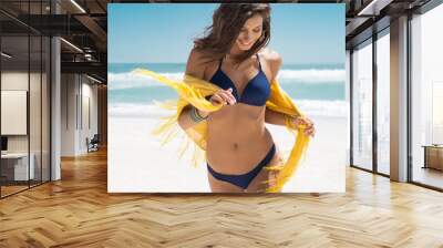 Beautiful woman running on beach Wall mural