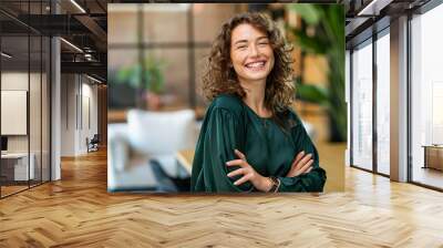 Beautiful woman smiling with crossed arms Wall mural