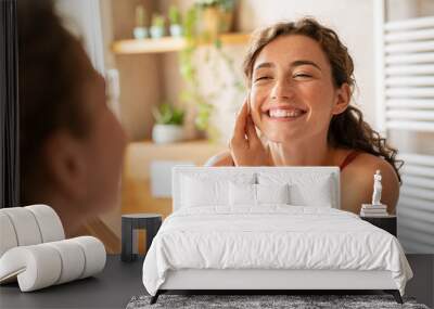 Beauty woman using cotton pad to remove make up Wall mural